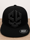 Snap Vault black skull logo plate on black snapback cap