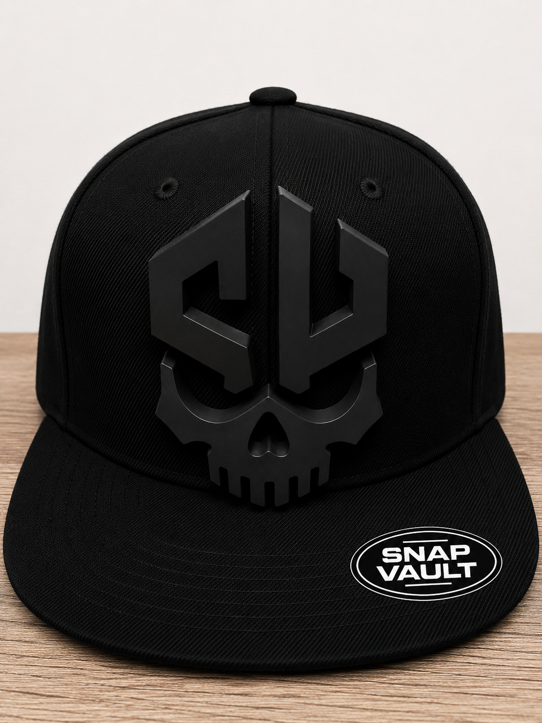 Snap Vault black skull logo plate on black snapback cap